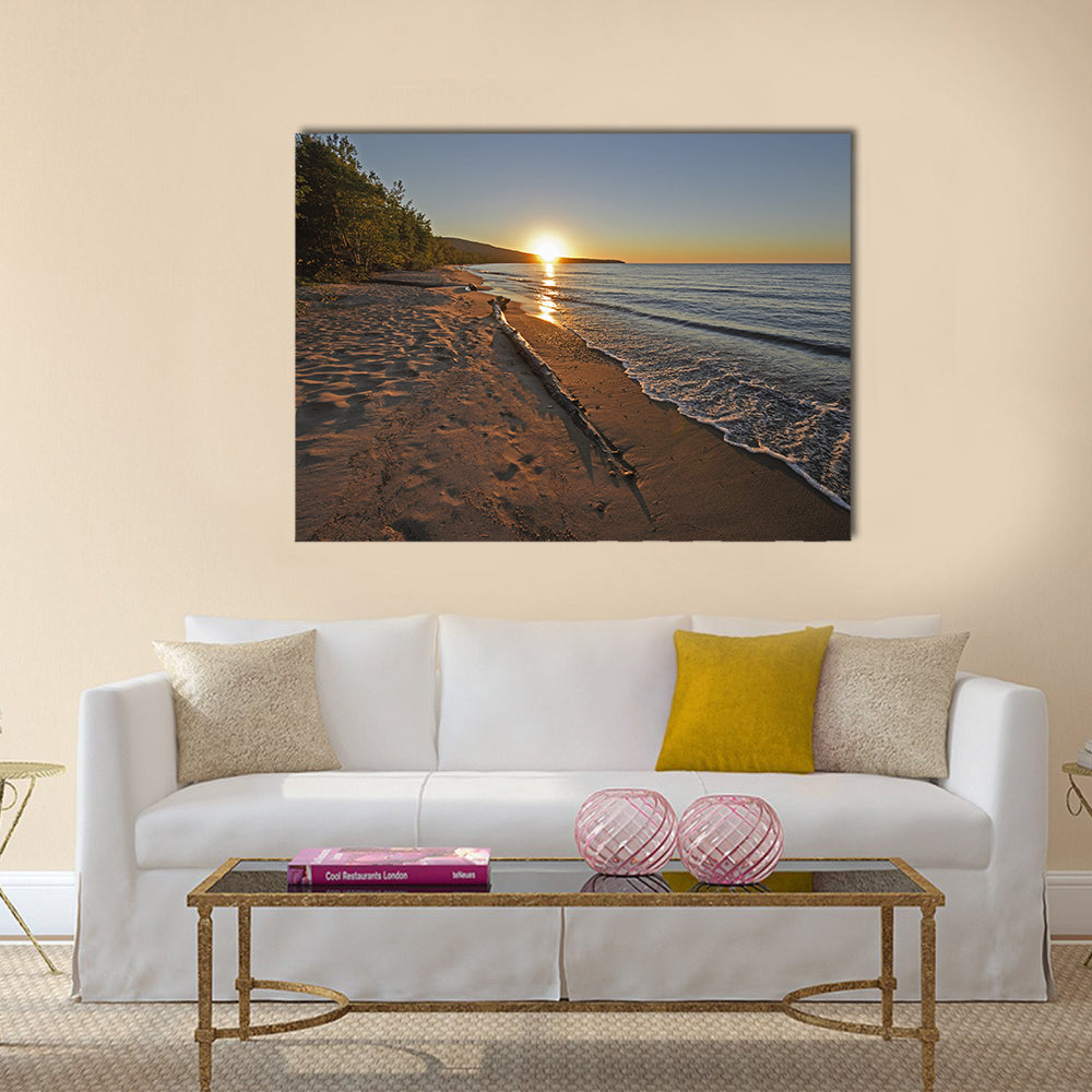 Lake Superior at Sunset Canvas Wall Art in brown, orange and blue, single panel hung on a wall