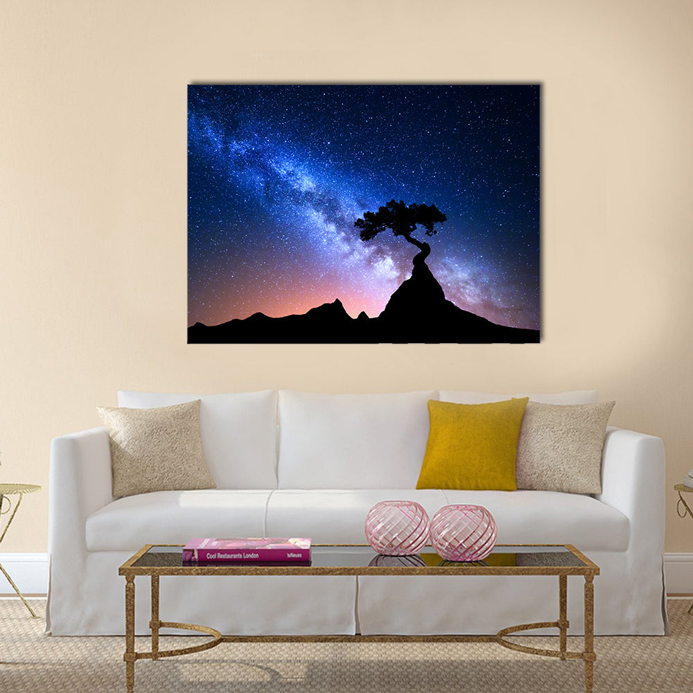 Alone Tree Under Starry Sky Canvas Wall Art in black, blue and purple, single panel hung on a wall