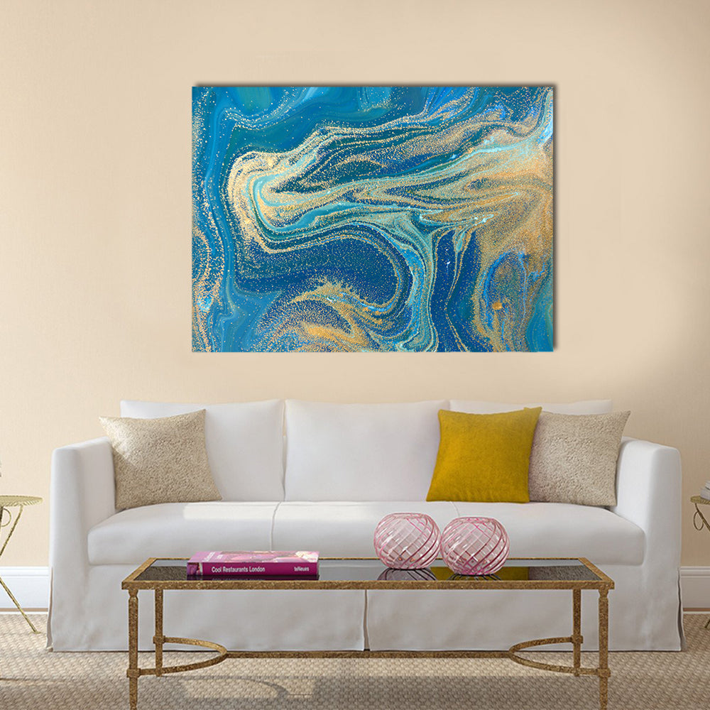 Blue and Gold Fluid Abstract Canvas Wall Art in gold and blue, single panel hung on a wall