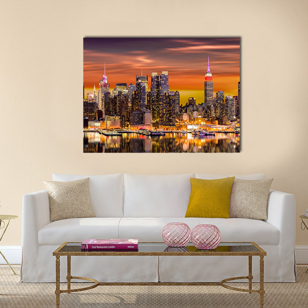 New York City At Sunrise Canvas Wall Art in black, orange and yellow, single panel hung on a wall