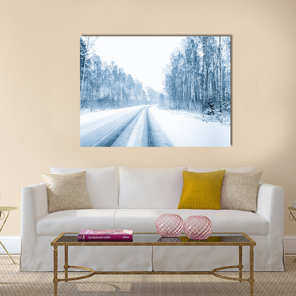 Snow Covered Open Road In Winter Canvas Wall Art in white, gray and blue, single panel hung on a wall