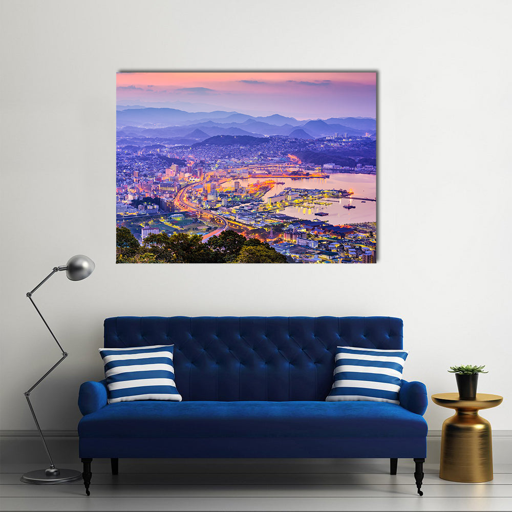 Sasebo Downtown Skyline In Nagasaki Japan Canvas Wall Art in orange, blue and purple, single panel hung on a wall
