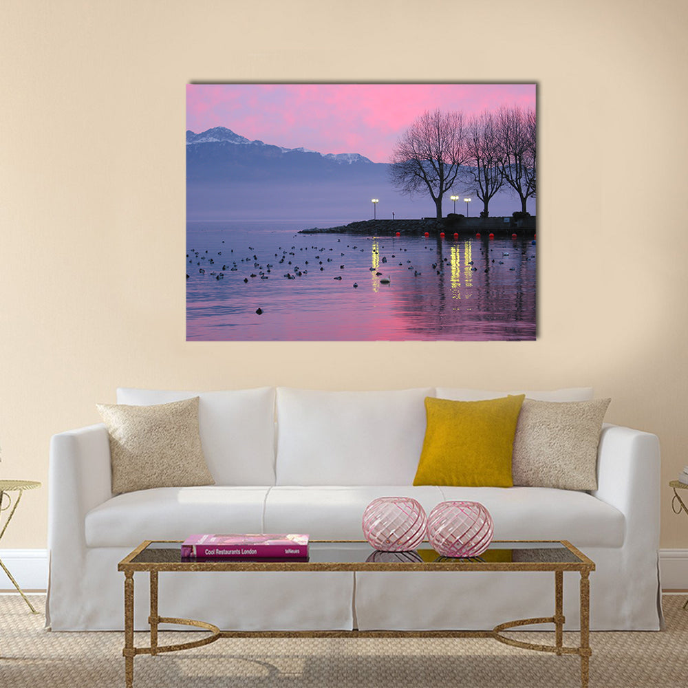 Sunset On Lake Geneva Canvas Wall Art in blue, purple and pink, single panel hung on a wall