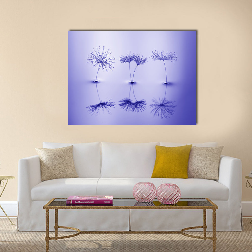 Dandelion Seeds on Water Canvas Wall Art in blue and purple, single panel hung on a wall