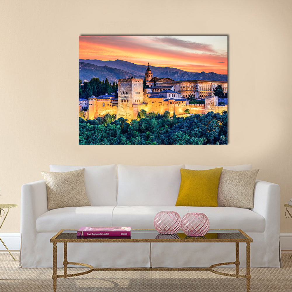 Alhambra Fortress At Sunset Canvas Wall Art in orange, yellow and blue, single panel hung on a wall