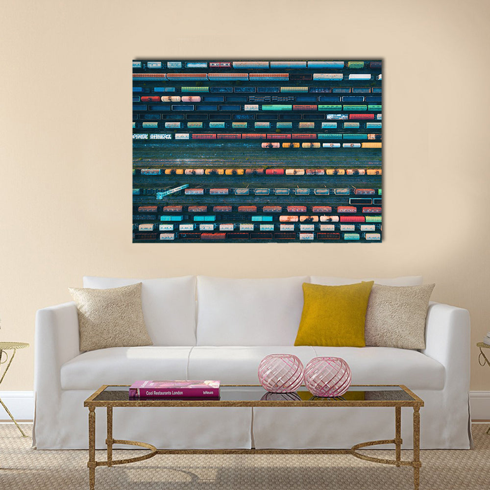 Cargo Trains Close Up Canvas Wall Art in gray, blue and multicolor, single panel hung on a wall