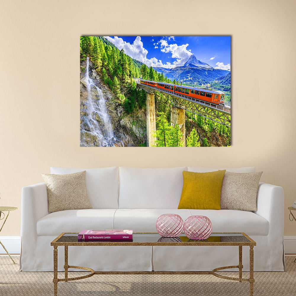 Gornergrat Tourist Train In Zermatt, Switzerland Canvas Wall Art in orange, green and blue, single panel hung on a wall