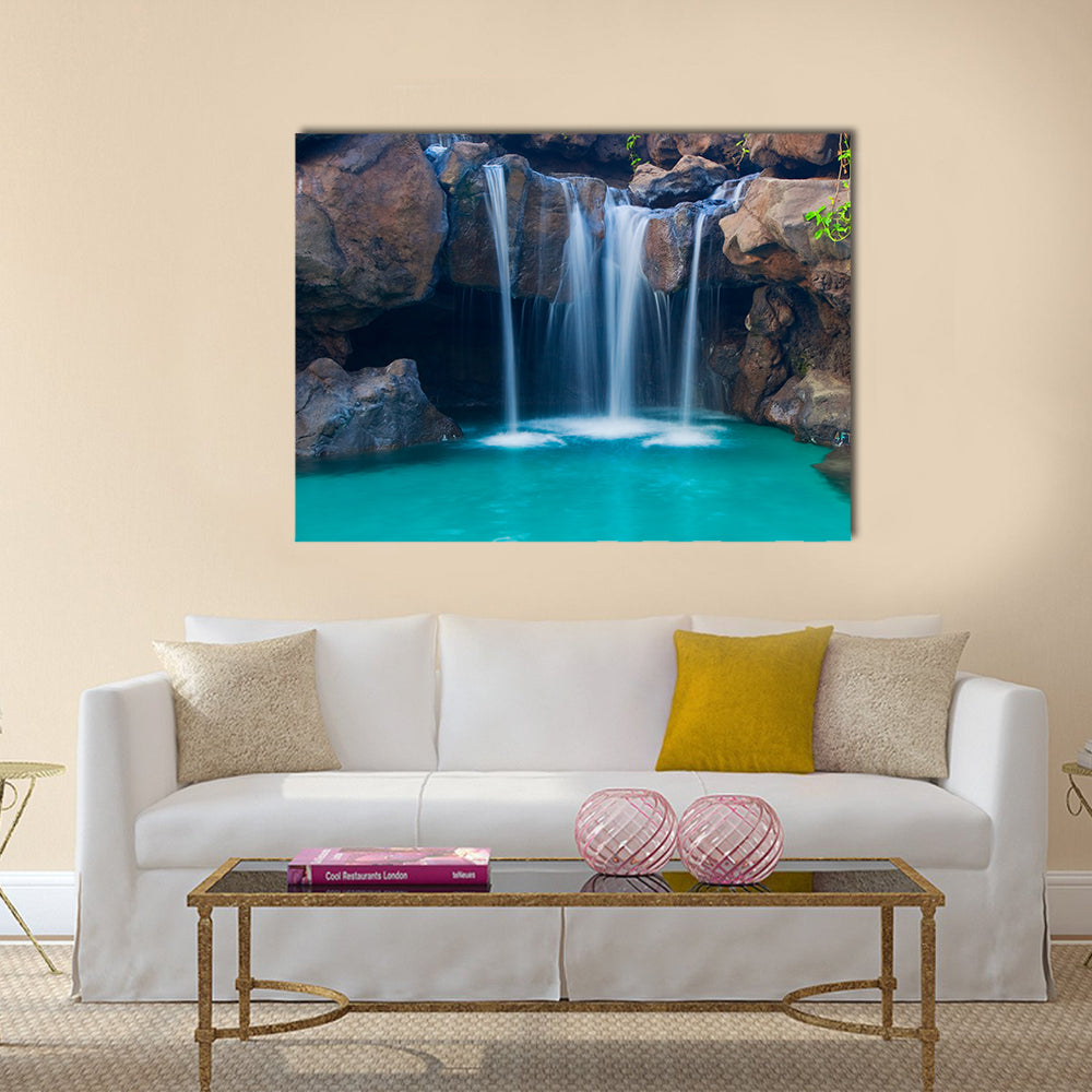 Waterfall Into Hotel Pool In Hawaii Canvas Wall Art in white, brown and blue, single panel hung on a wall