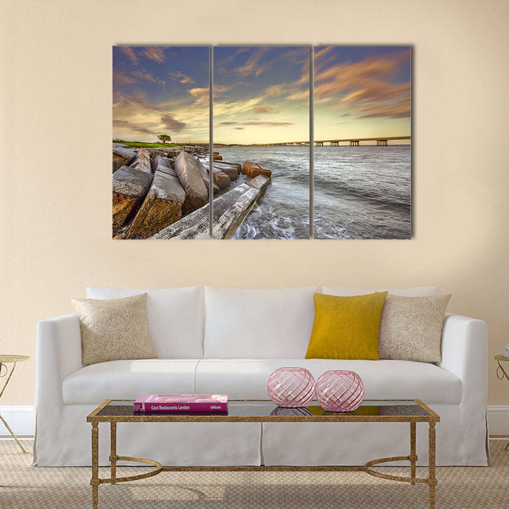 Two Bridges Between Amelia Island and Big Talbot Island Canvas Wall Art in brown, orange and blue, 3 panel horizontal set hung on a wall