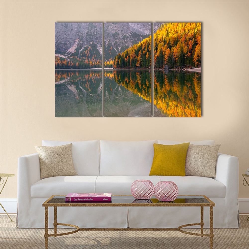 Braies Lake in Autumn Canvas Wall Art in gray, yellow and green, 3 panel horizontal set hung on a wall