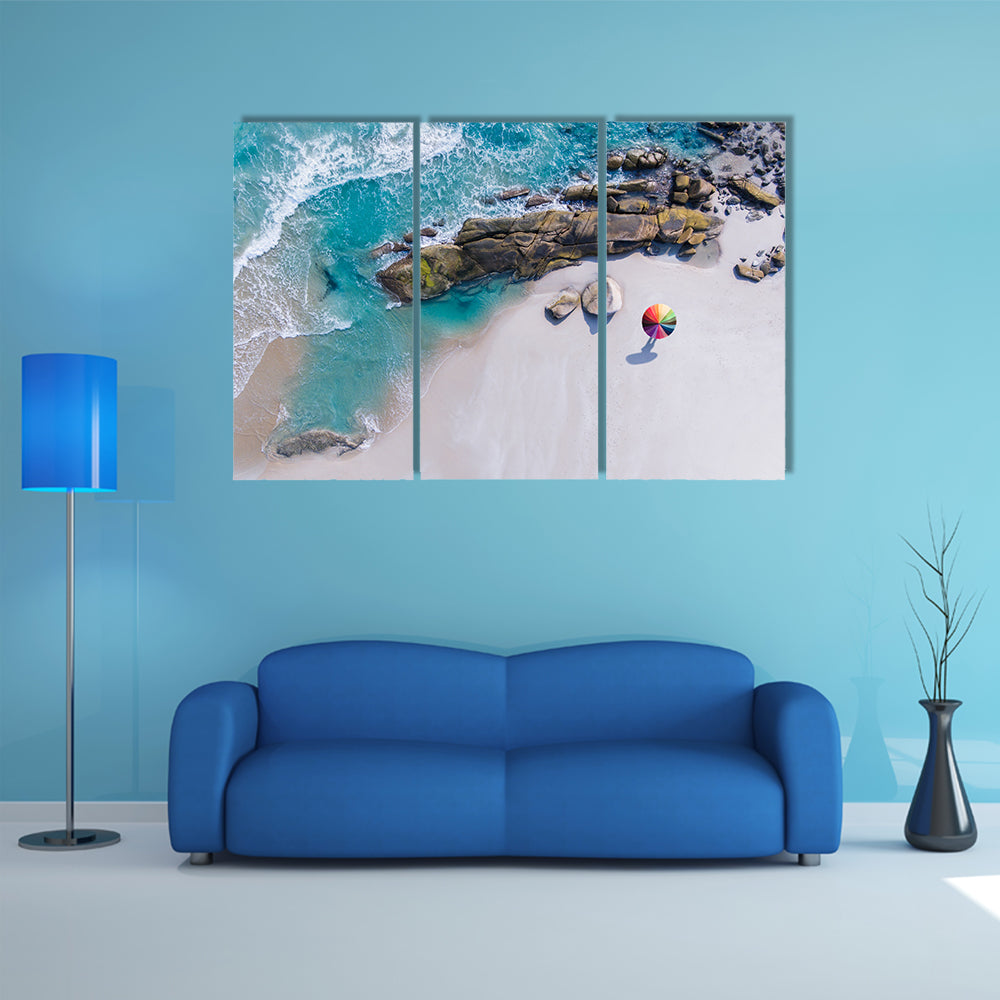 Umbrella On The Beach And Foam Of Sea Wave Canvas Wall Art