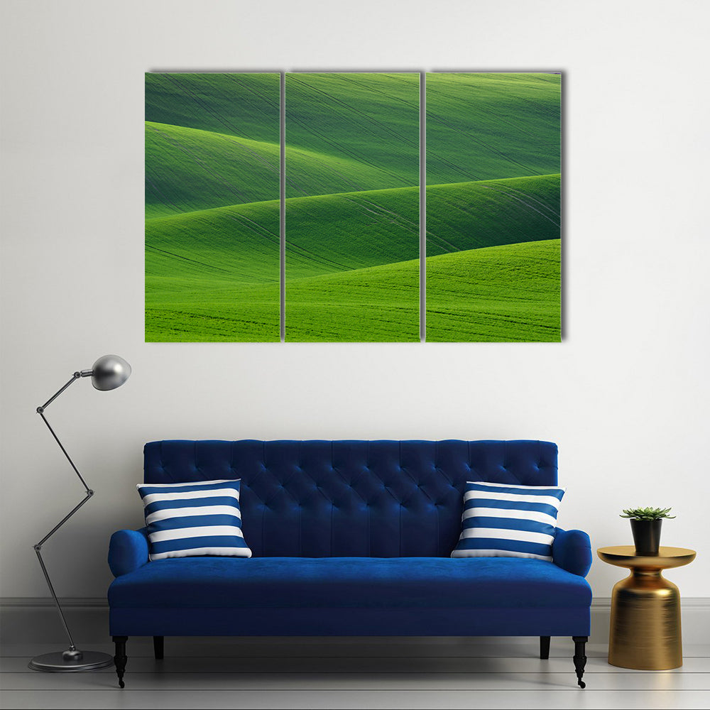 Rolling Green Hills in South Moravia Canvas Wall Art in green, 3 panel horizontal set hung on a wall