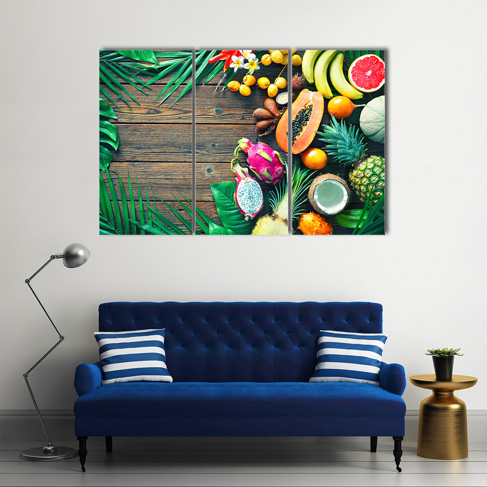 Tropical Fruit Assortment Canvas Wall Art in brown, green and multicolor, 3 panel horizontal set hung on a wall