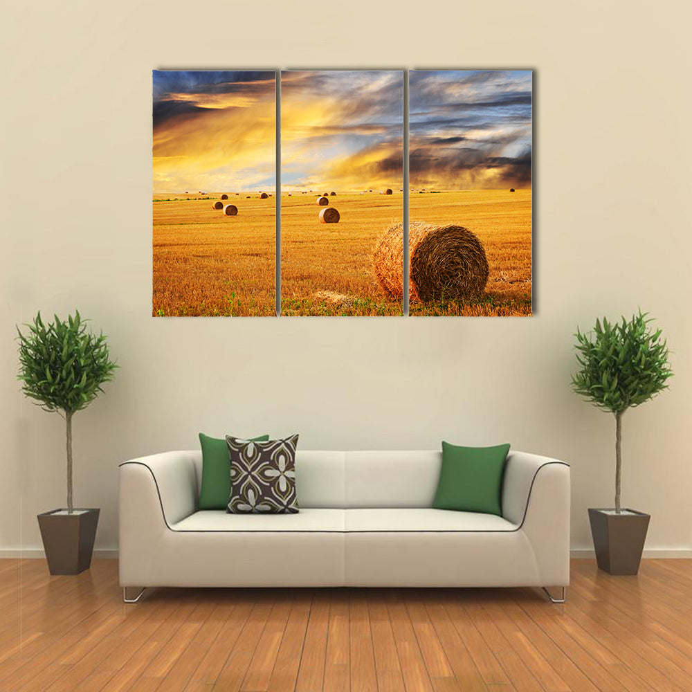 Golden Sunset Over Farm Field With Hay Bales Canvas Wall Art