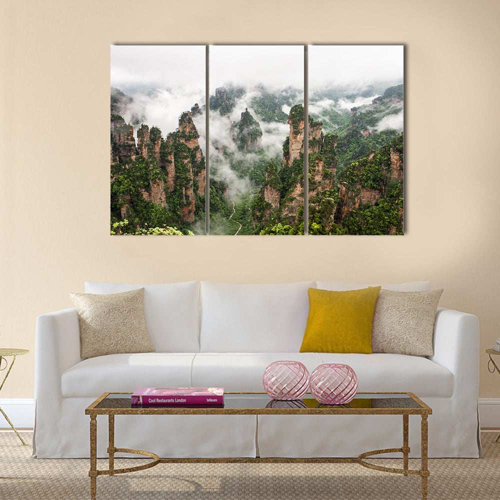 Zhangjiajie Misty Sandstone Pillars Canvas Wall Art in white, gray and green, 3 panel horizontal set hung on a wall