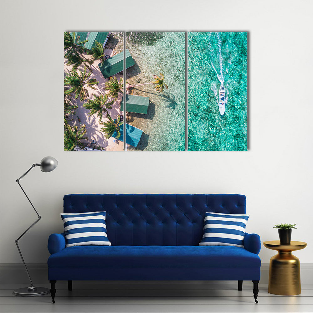 Aerial View of Tropical Island Coast Canvas Wall Art in green and blue, 3 panel horizontal set hung on a wall