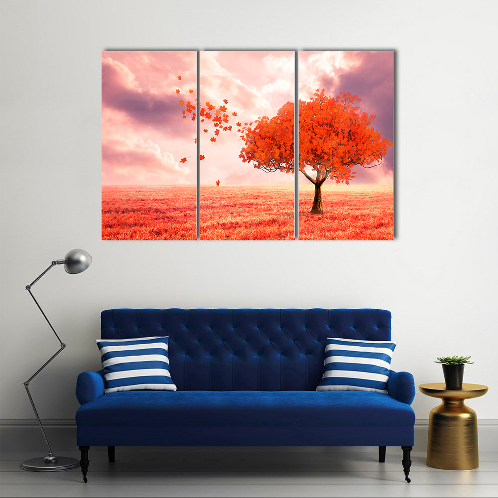 Dreamlike Red Autumn Tree Canvas Wall Art in red, orange and pink, 3 panel horizontal set hung on a wall