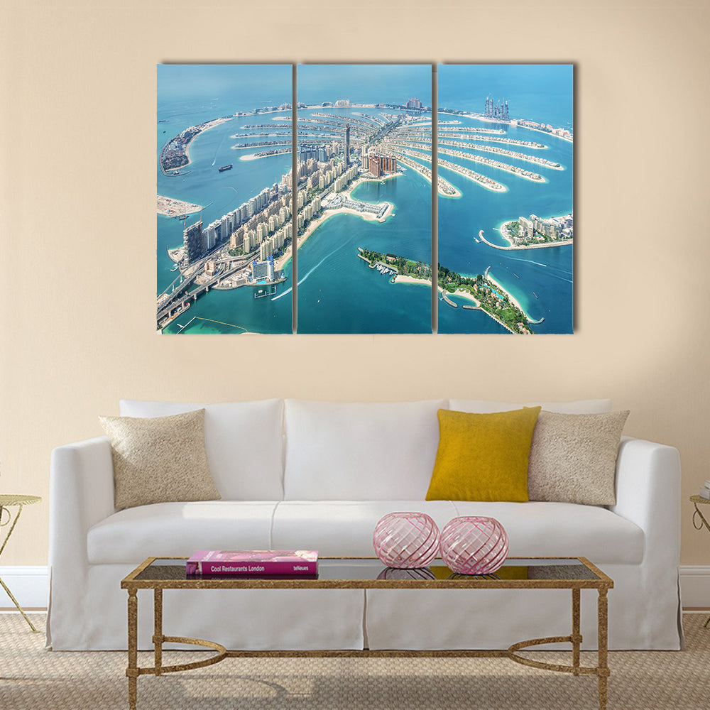 Aerial View of Palm Jumeirah, Dubai Canvas Wall Art in white, beige and blue, 3 panel horizontal set hung on a wall