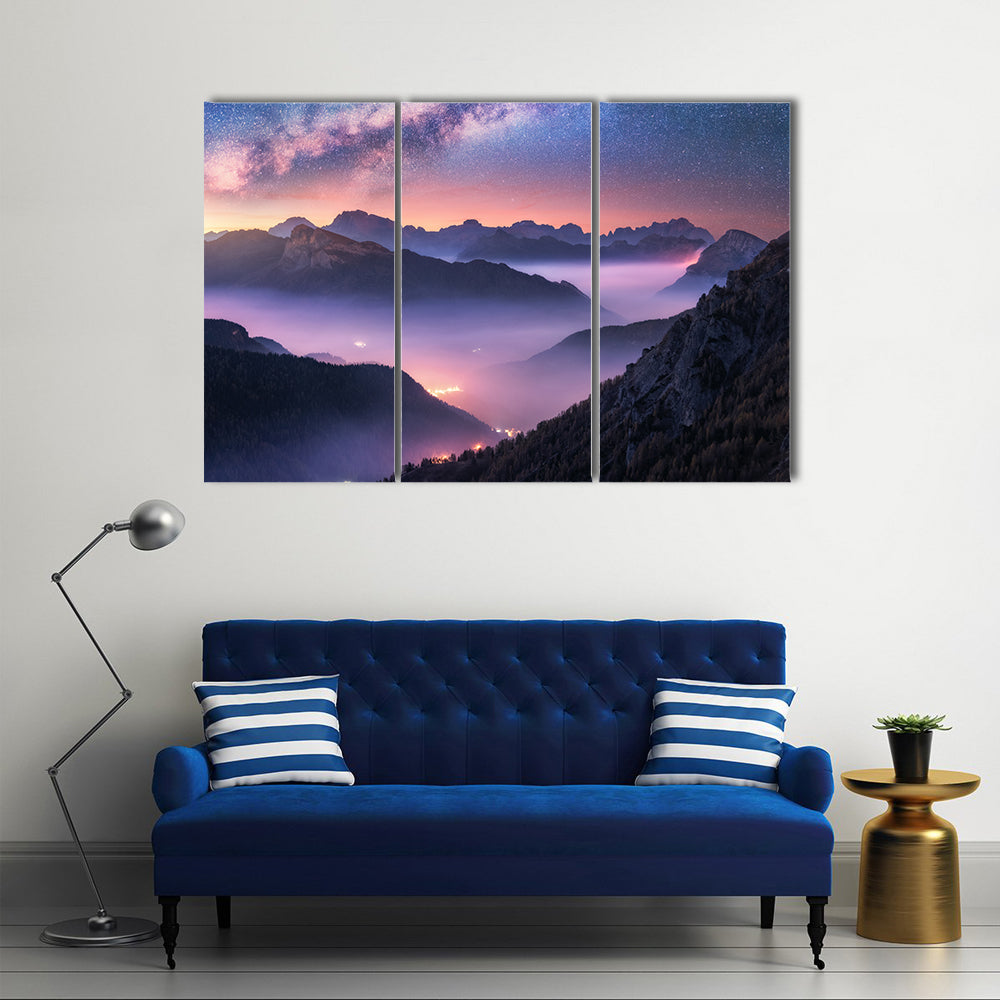 Milky Way Over Passo Giau, Dolomites Canvas Wall Art in black, blue and purple, 3 panel horizontal set hung on a wall