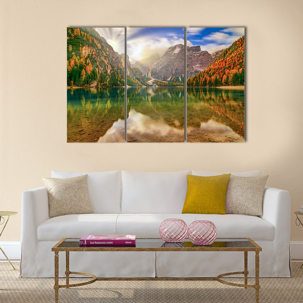 Autumn Reflection at Braies Lake Canvas Wall Art in brown, orange and blue, 3 panel horizontal set hung on a wall