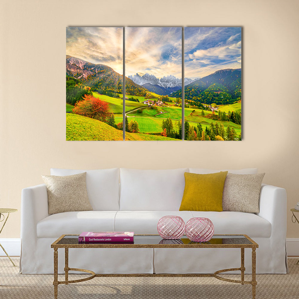 Santa Maddalena at Sunrise Canvas Wall Art in yellow, green and blue, 3 panel horizontal set hung on a wall