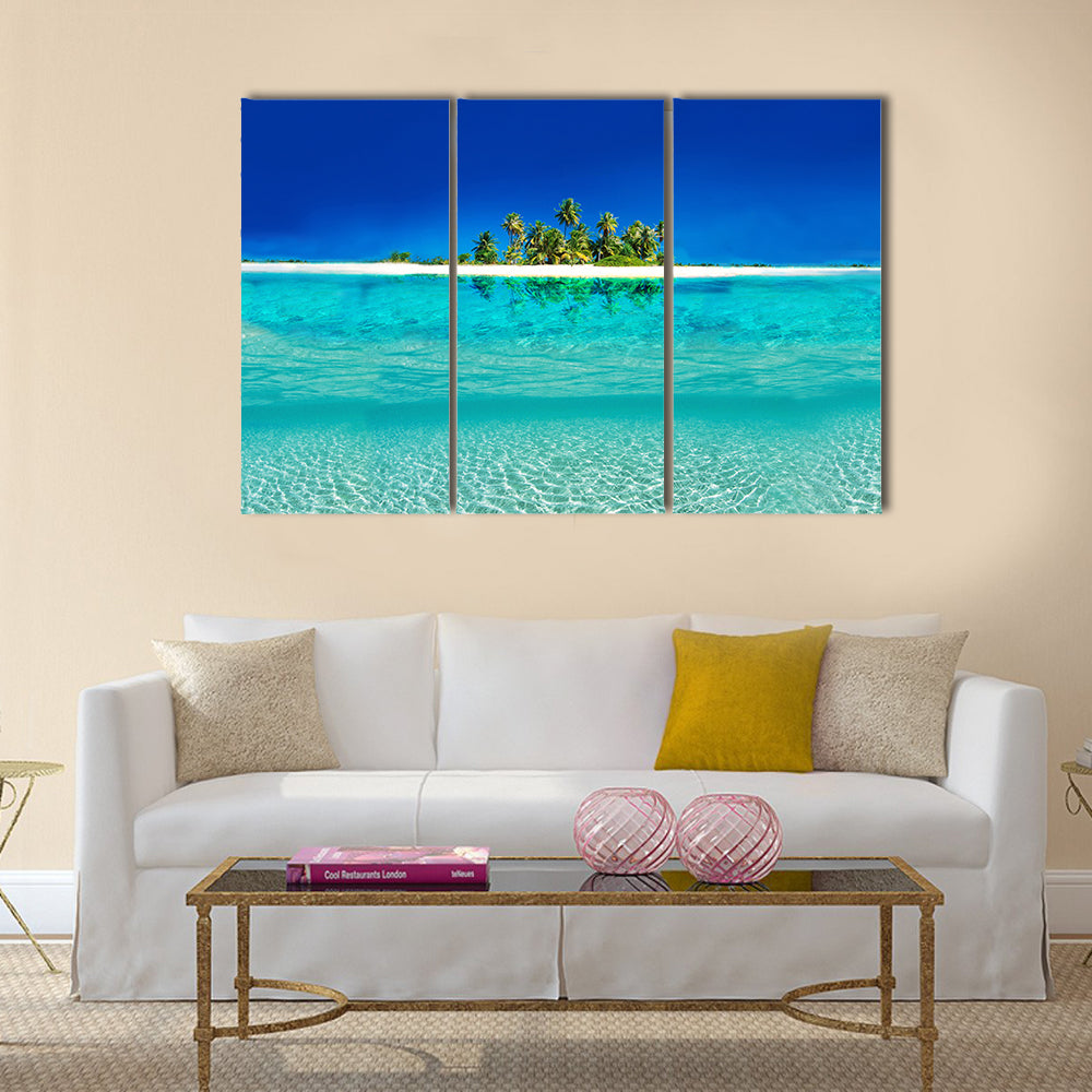 Tropical Island Reflection on the Sea Canvas Wall Art in white and blue, 3 panel horizontal set hung on a wall