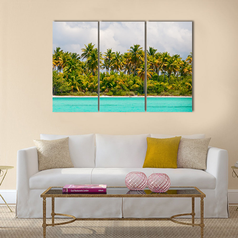 Tropical Palm Trees Island Canvas Wall Art in white, green and blue, 3 panel horizontal set hung on a wall