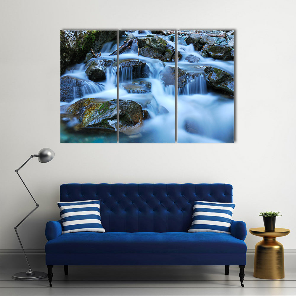 River Through Mossy Stones in Cadore Canvas Wall Art
