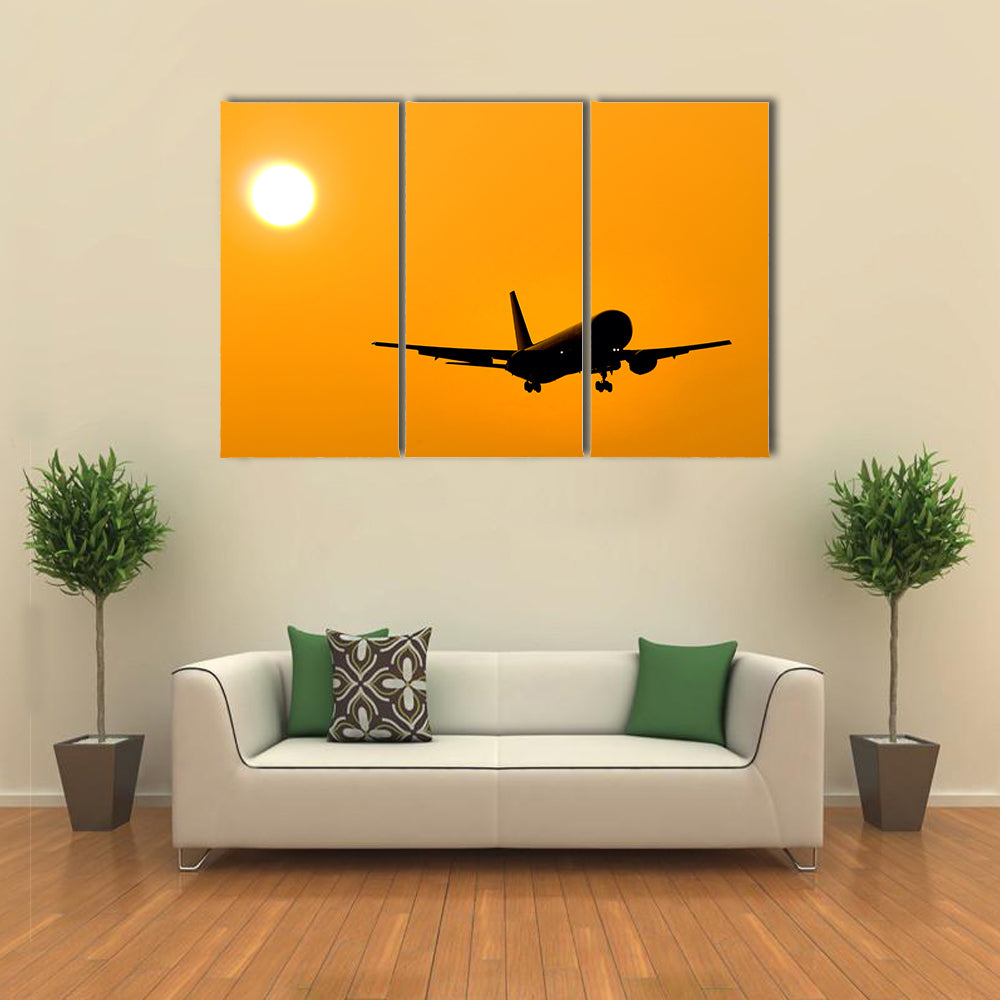 Aircraft Landing At Sunset Canvas Wall Art