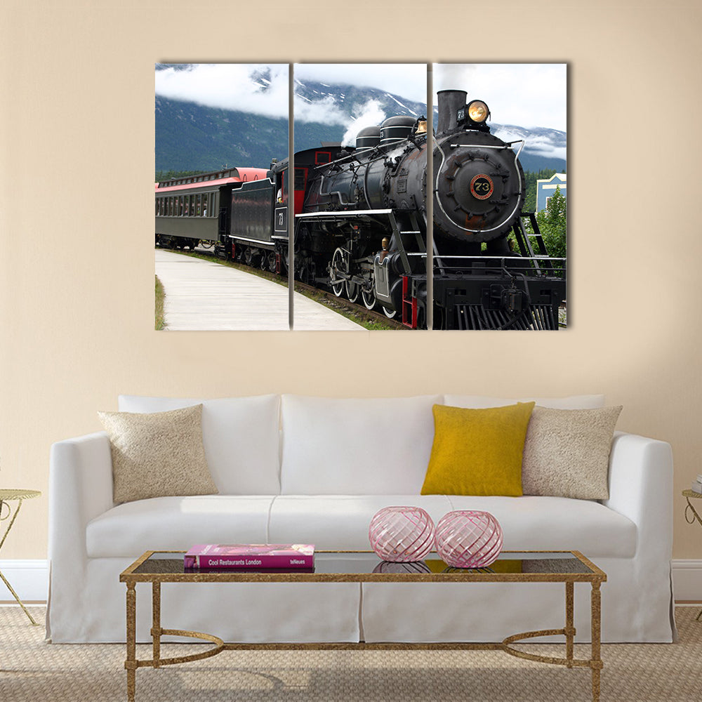 Number 73 Steam Locomotive Departing Station Canvas Wall Art in black, white and gray, 3 panel horizontal set hung on a wall