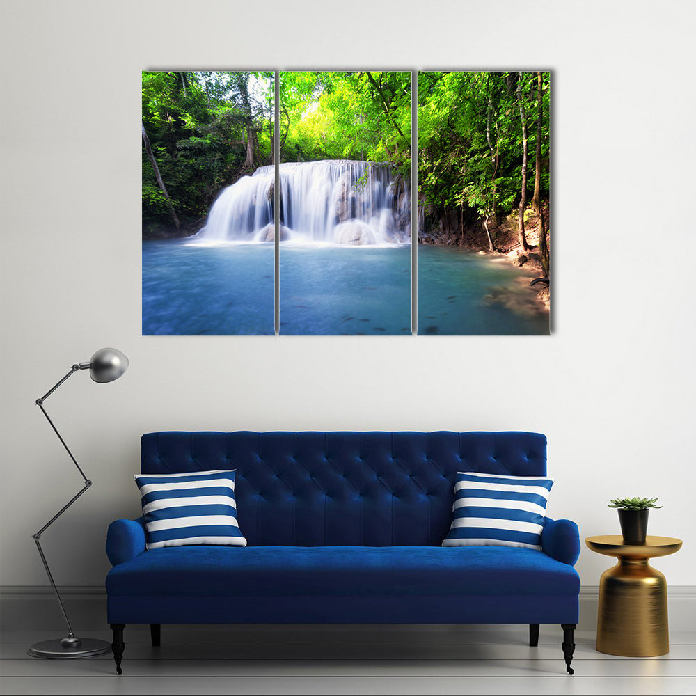 Tropical Waterfall in Thailand Canvas Wall Art in white, green and blue, 3 panel horizontal set hung on a wall