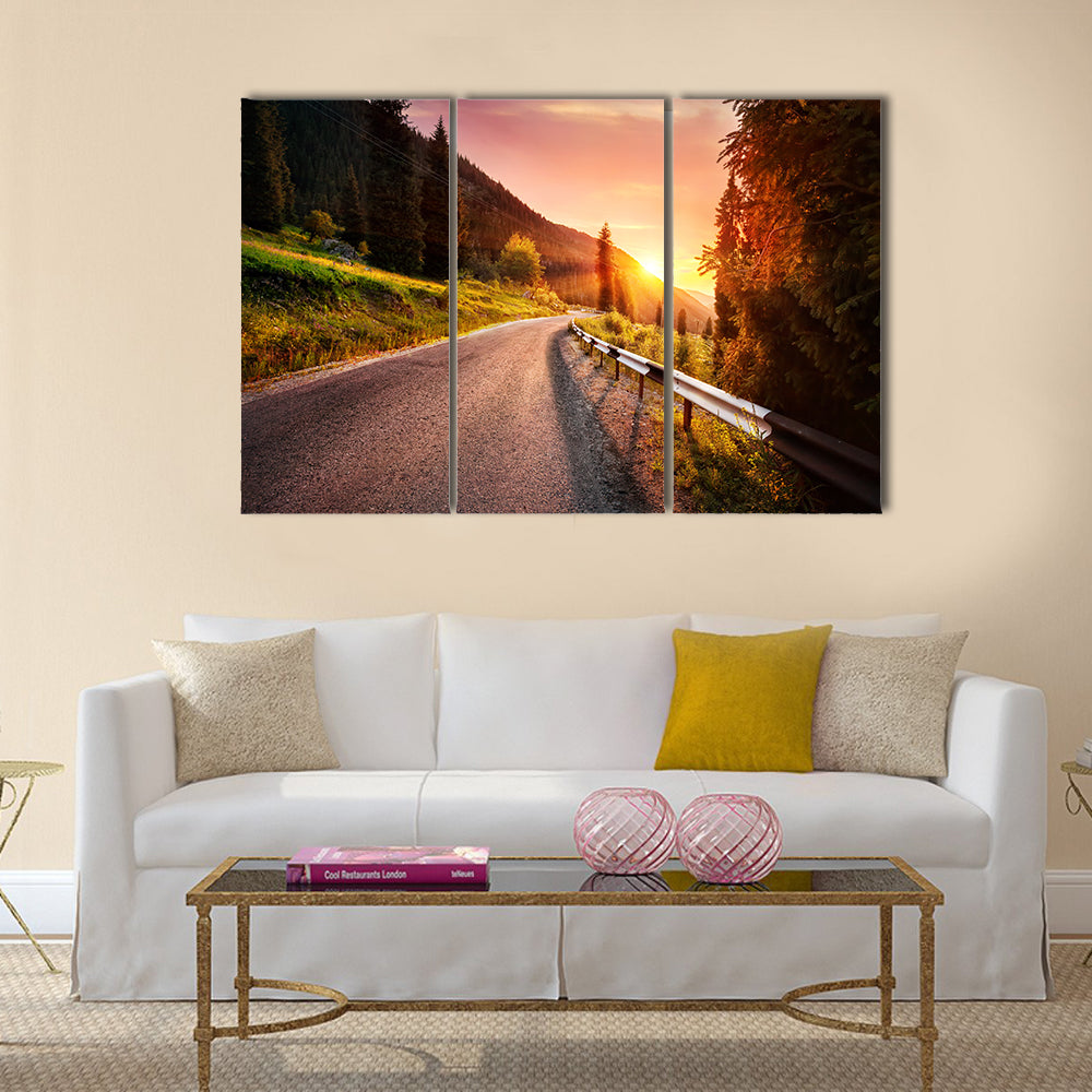 Mountain Road at Sunset in Kazakhstan Canvas Wall Art in orange, yellow and green, 3 panel horizontal set hung on a wall