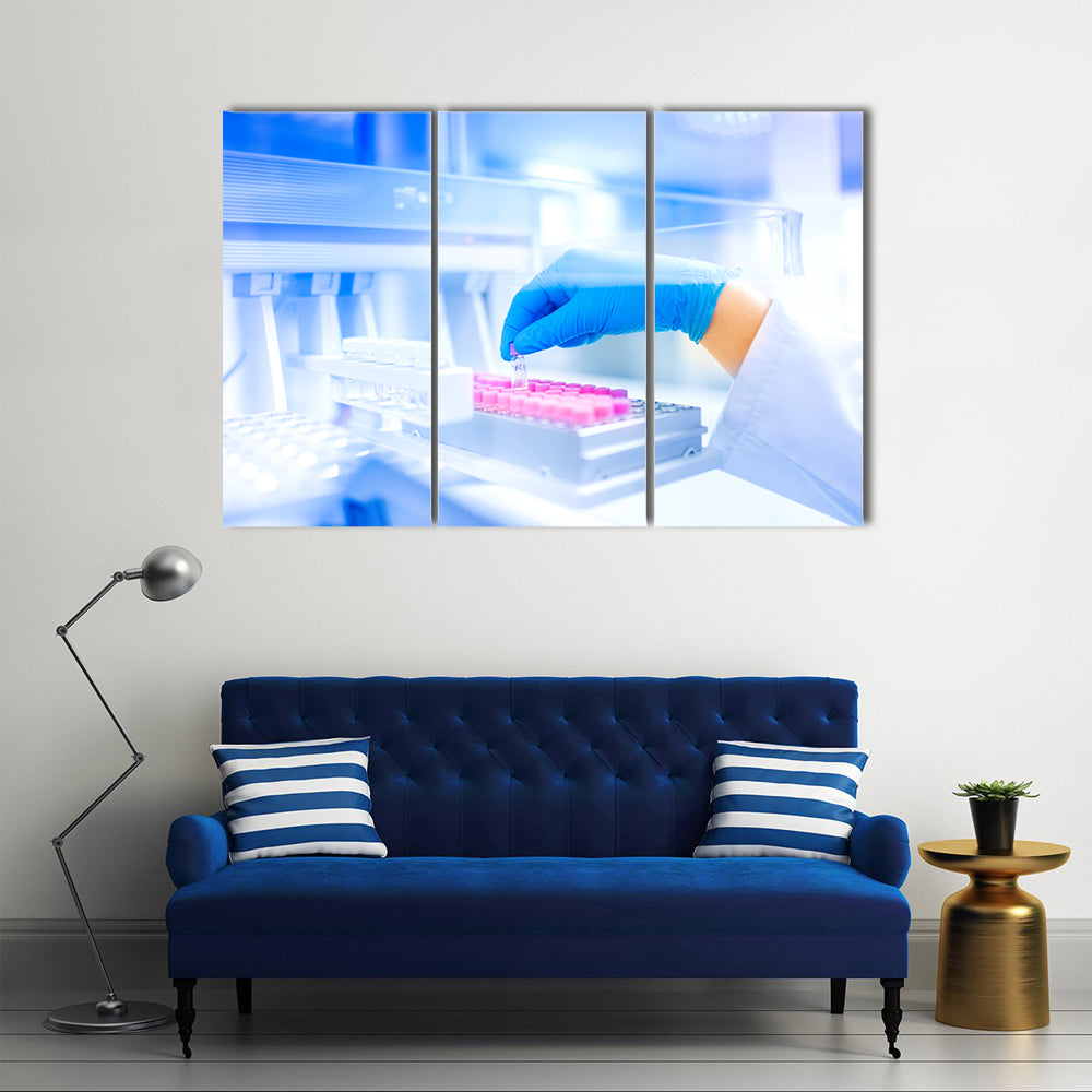 Hand Holding Vial in Medical Laboratory Canvas Wall Art