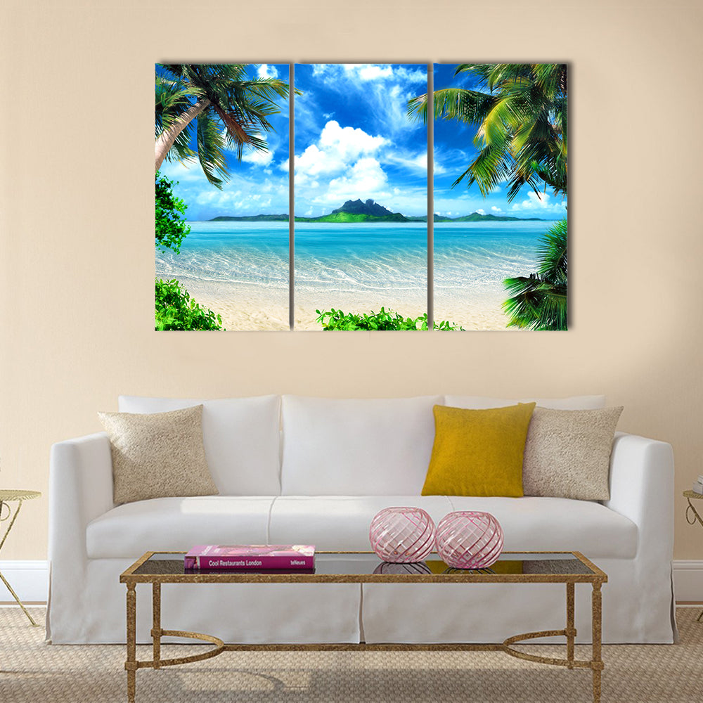Tropical Beach with Turquoise Ocean Canvas Wall Art in beige, green and blue, 3 panel horizontal set hung on a wall