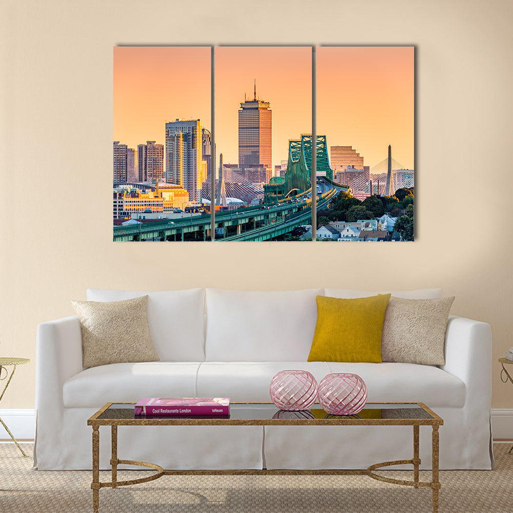 Tobin Bridge and Boston Skyline Canvas Wall Art in orange, yellow and green, 3 panel horizontal set hung on a wall