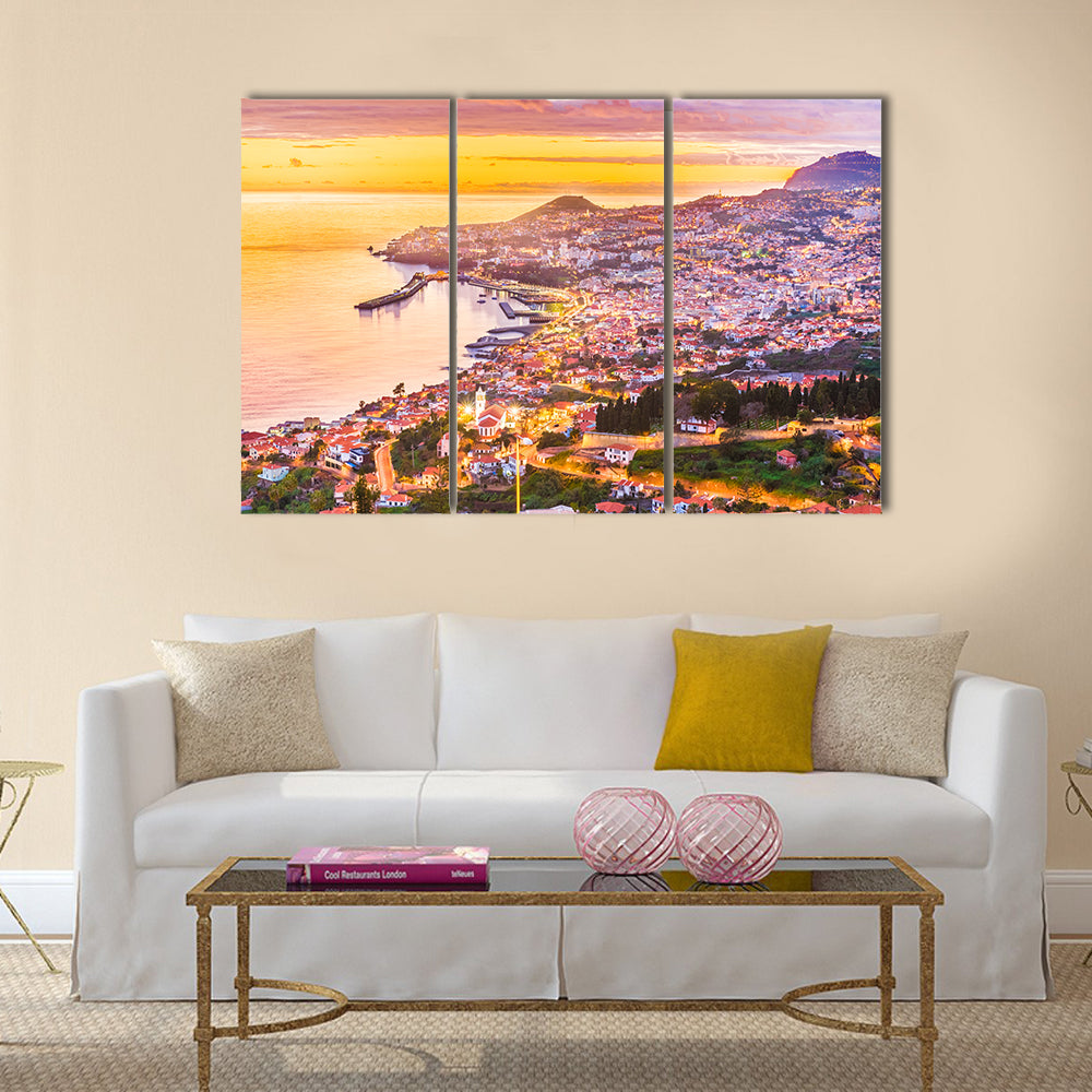 Madeira Island Sunset Harbor Canvas Wall Art in orange, yellow and pink, 3 panel horizontal set hung on a wall
