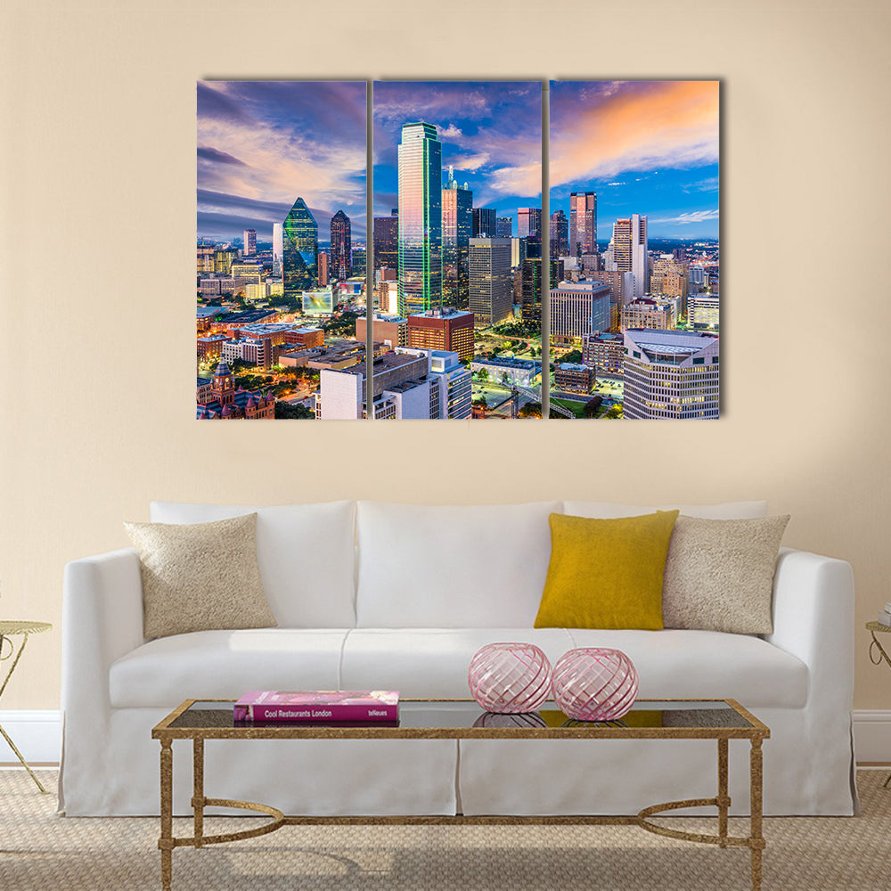 Dallas Skyline at Twilight Canvas Wall Art in orange, blue and purple, 3 panel horizontal set hung on a wall
