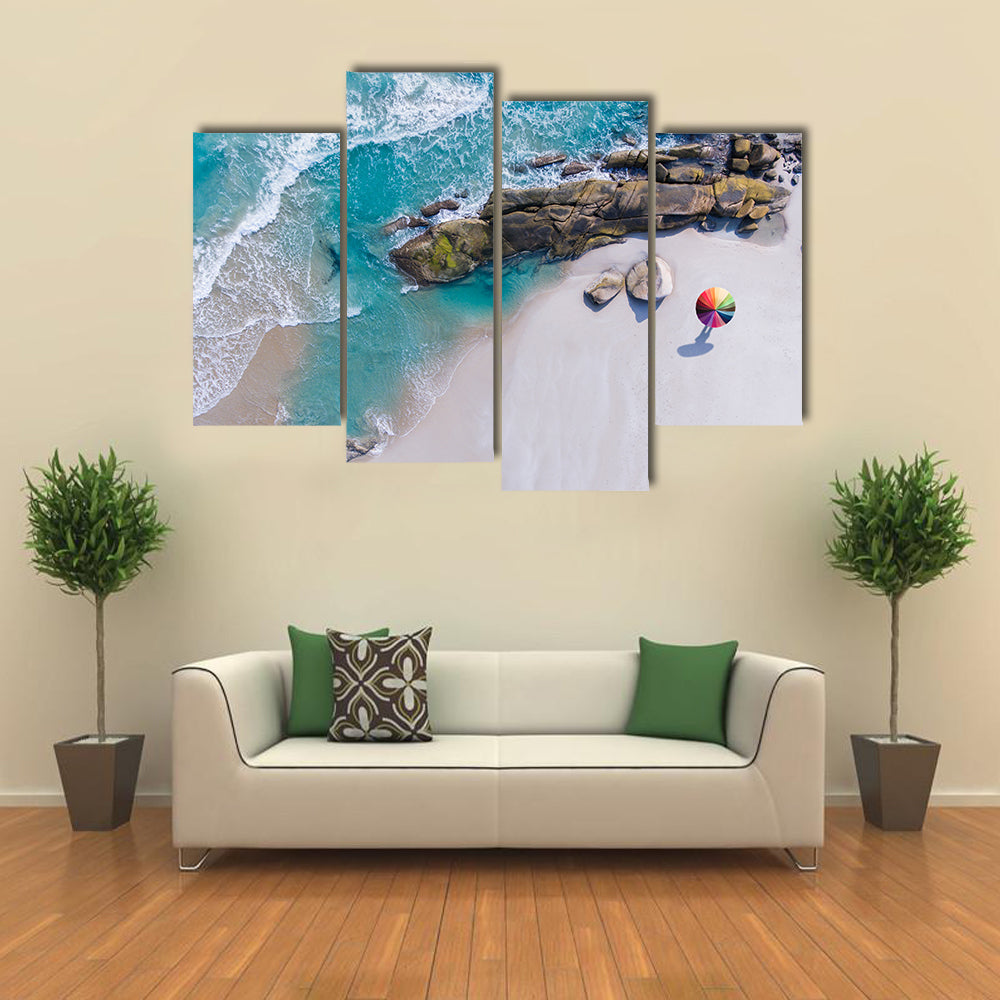 Umbrella On The Beach And Foam Of Sea Wave Canvas Wall Art