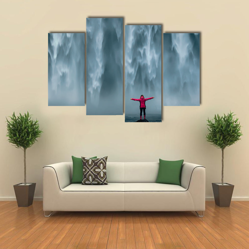 Girl Against Skogafoss Waterfall At South Iceland Canvas Wall Art