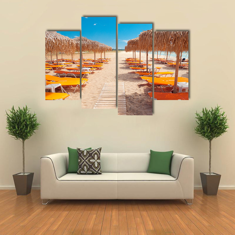 Greek Beach with Wooden Walkway and Orange Loungers Canvas Wall Art