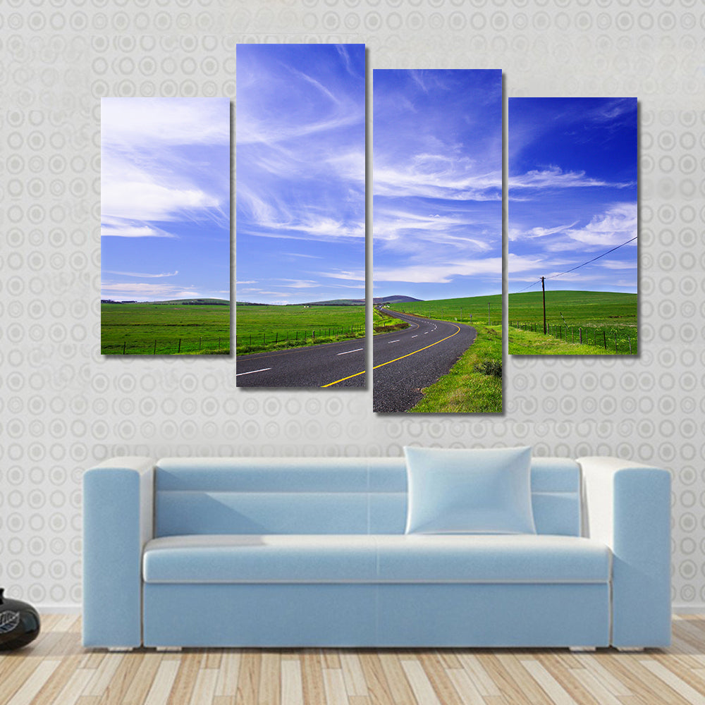 Winding Road Through Green Fields Canvas Wall Art