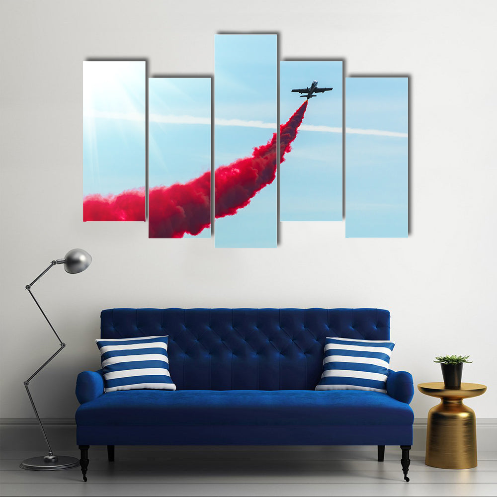 Airplane fly With Red Trail Smoke Canvas Wall Art