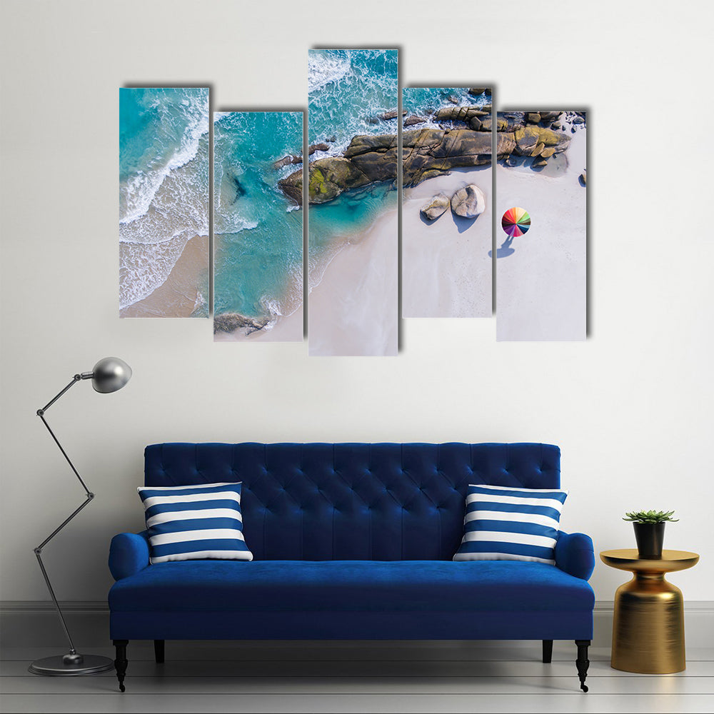 Umbrella On The Beach And Foam Of Sea Wave Canvas Wall Art