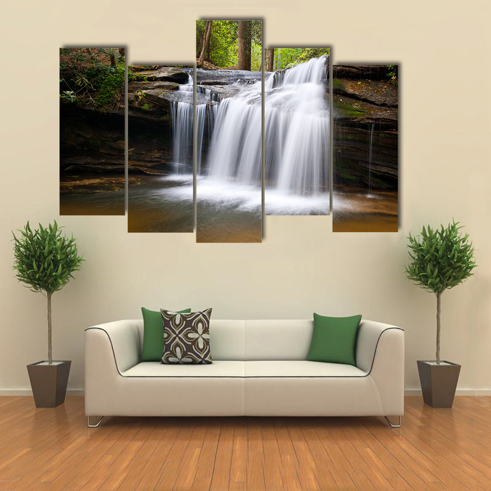 Cascading Forest Waterfall Over Layered Rocks Canvas Wall Art