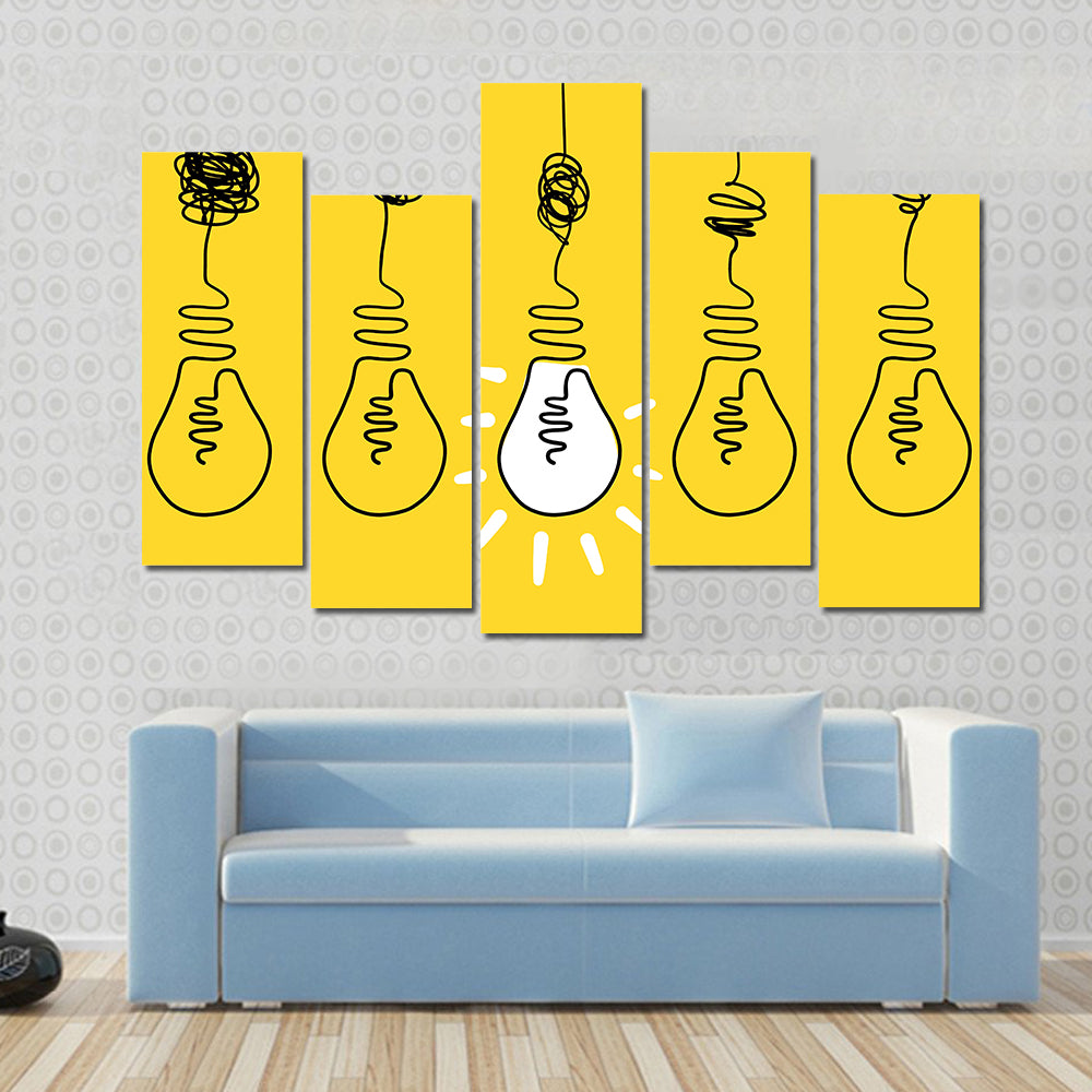 Four Lightbulbs Technology Concept Canvas Wall Art in black, white and yellow, 5 panel Pop layout hung on a wall