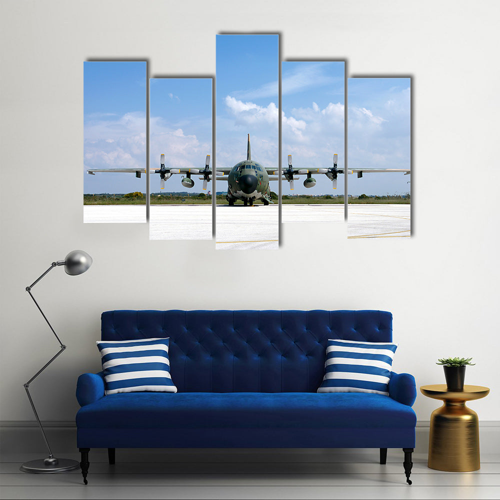 Military Airplane Parked At An Airbase Canvas Wall Art