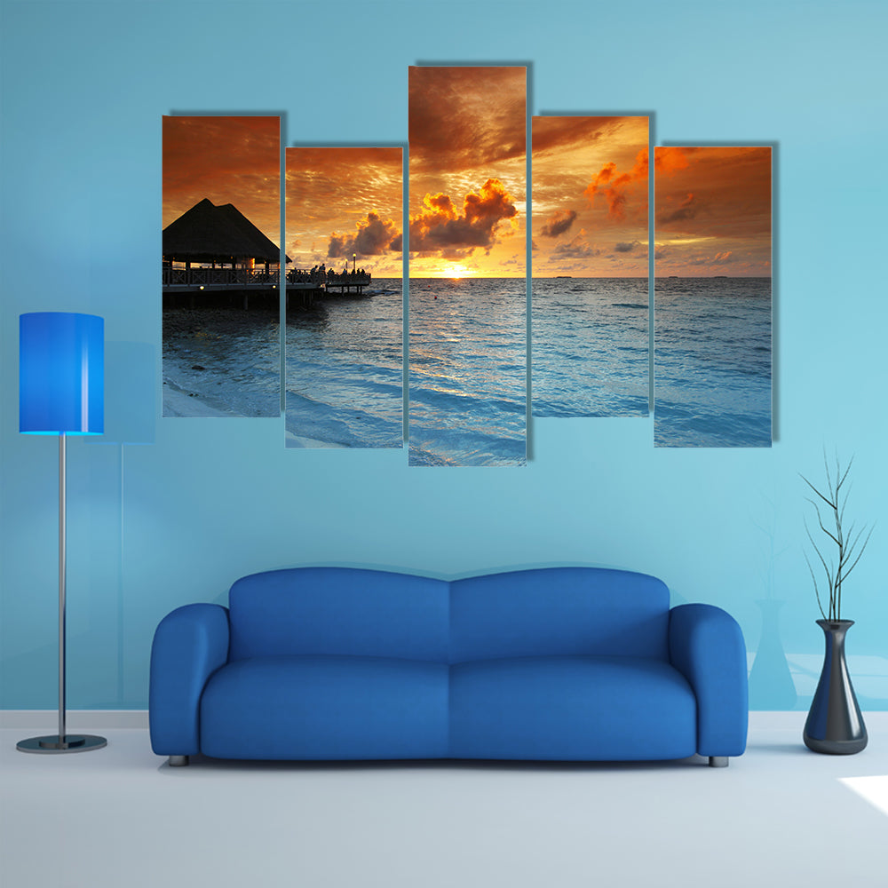 Maldives Thatched Hut on Pier at Sunset Canvas Wall Art