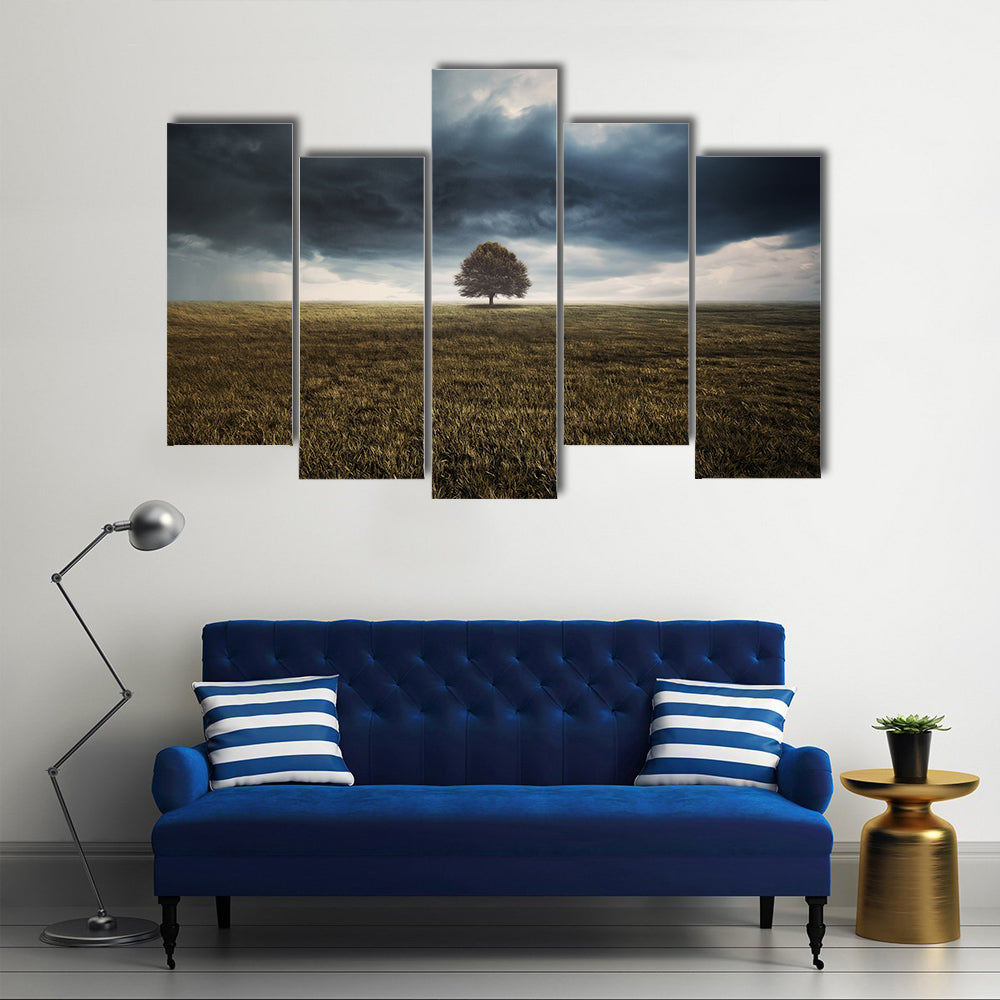 Tree In Field Under Storm Clouds Canvas Wall Art