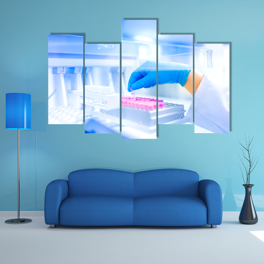 Hand Holding Vial in Medical Laboratory Canvas Wall Art