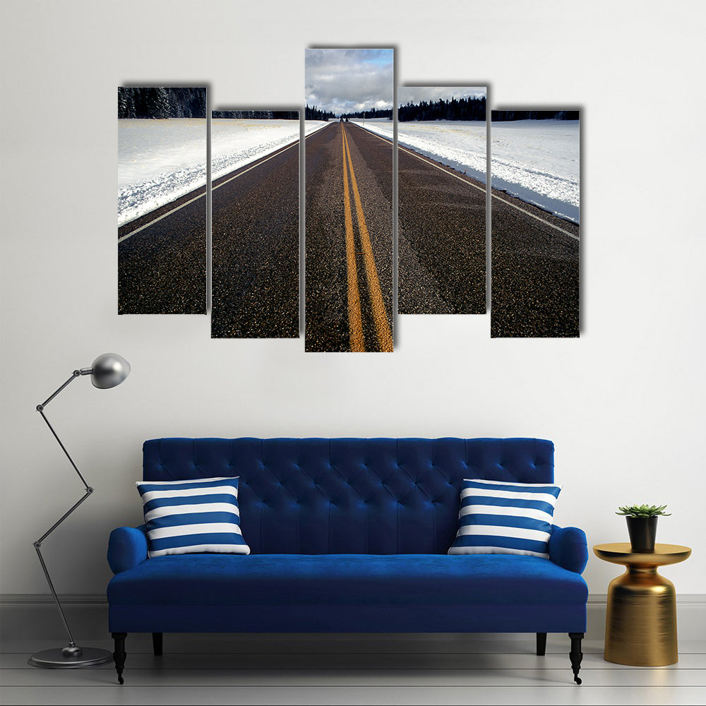 Straight Strip Of Road In Winter Canvas Wall Art